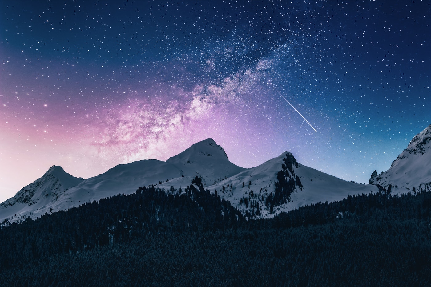 Snowy mountain beneath a clear night sky