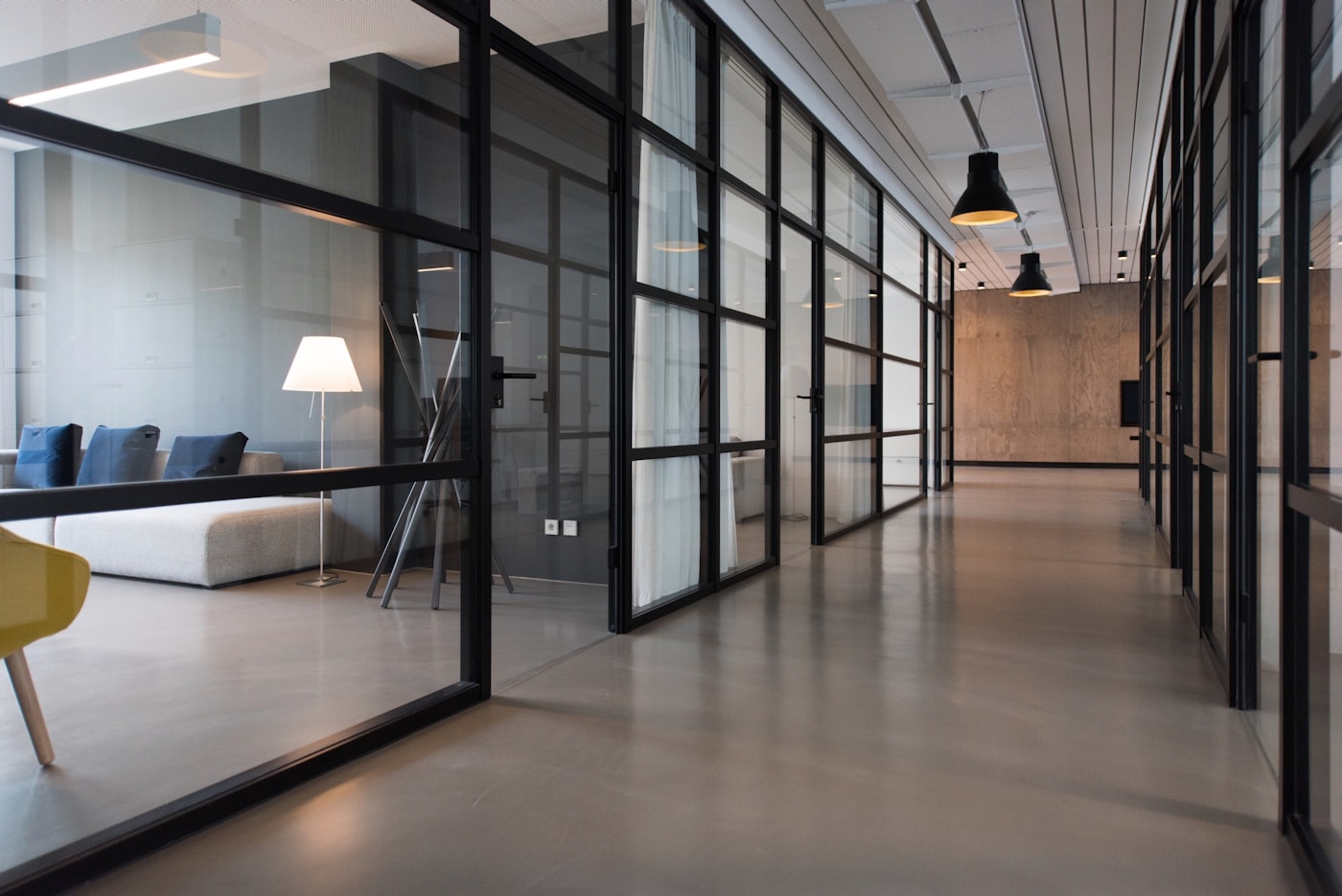 Minimal creative studio with a desk and warm daylight